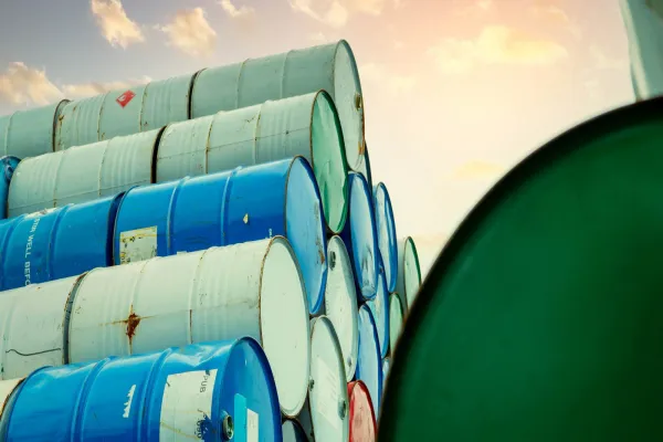 Old Chemical Barrels Stack. Red, Green, And Blue Chemical Drum. Steel Tank Of Flammable Liquid.