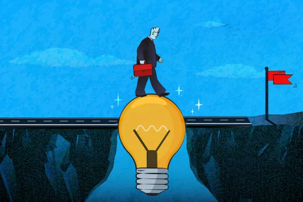 Businessman walking on a lightbulb to pass a gap between cliffs.