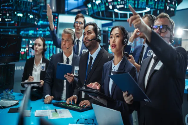 Diverse Stock Exchange Professionals Communicating