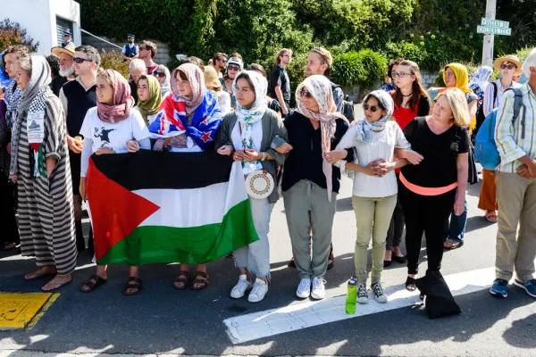 People gather to honor the victims of the Christchurch terrorist attack outside the Kilbernie Mosque in Wellington, New Zealand. (Mark Coote/Bloomberg)