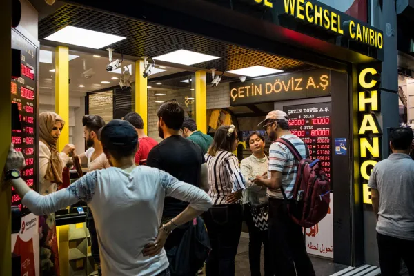 Tourists change money at a foreign currency bureau in Istanbul, Turkey. (Nicole Tung/Bloomberg)