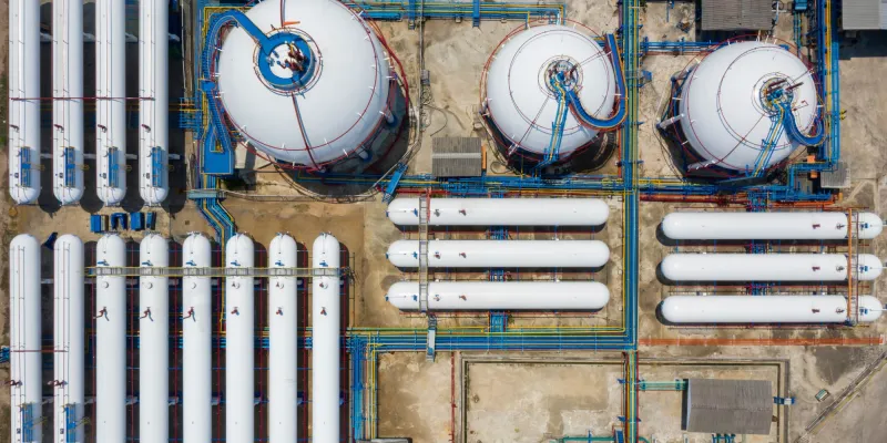 Aerial view white storage tank gas in station LPG gas, LNG or LPG distribution station facility, Oil and gas fuel manufacturing industry.