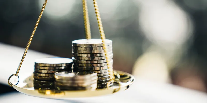 Coins stack with balance scale