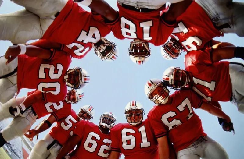 Football team in huddle