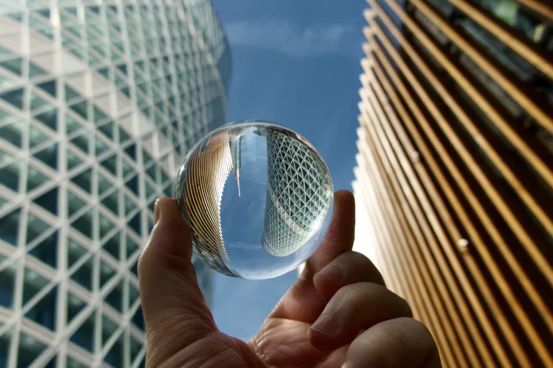 Crystal ball against modern buildings 