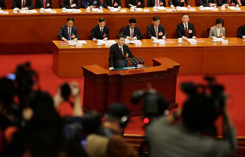 Xi Jinping, center, speaks at the National People’s Congress (Qilai Shen/Bloomberg)