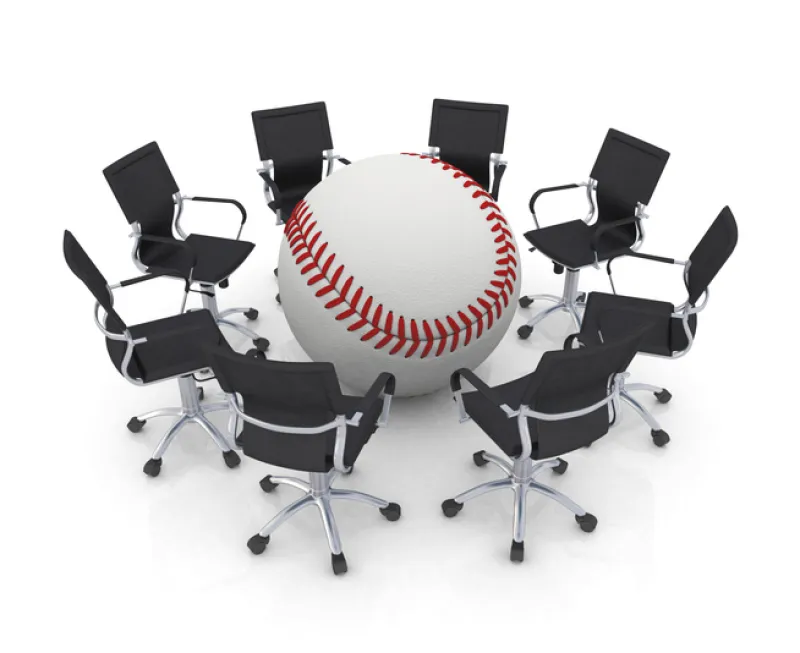 young businessmen playing baseball in officebaseball bat