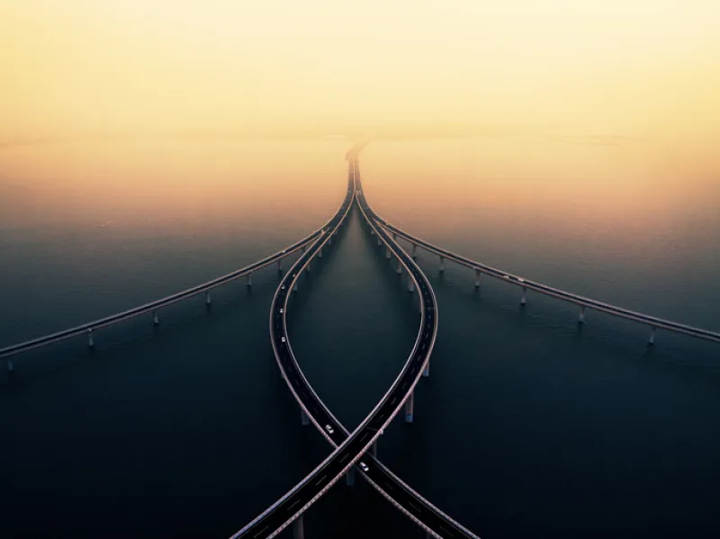 Sea crossing bridge at sunset