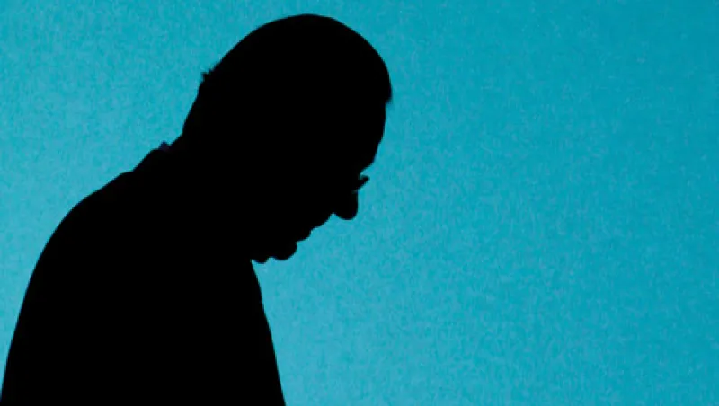 Swiss bank UBS CEO Gruebel is silhouetted as he walks on stage prior the start of the general shareholders meeting in Zurich