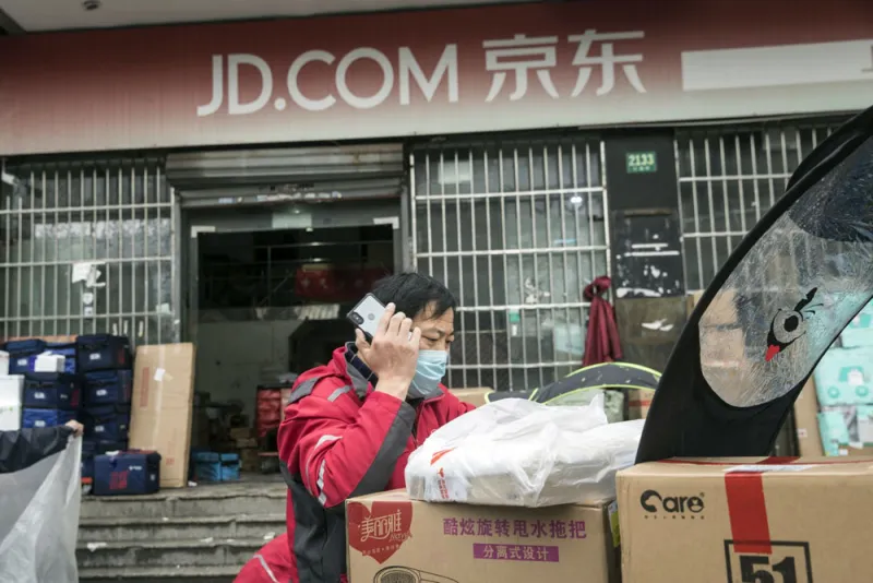   JD.com remains Tiger Global's largest long position. (Qilai Shen/Bloomberg)